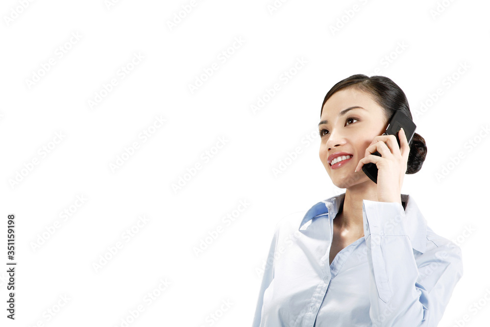 Businesswoman talking on mobile phone Businesswoman talking on mobile phone