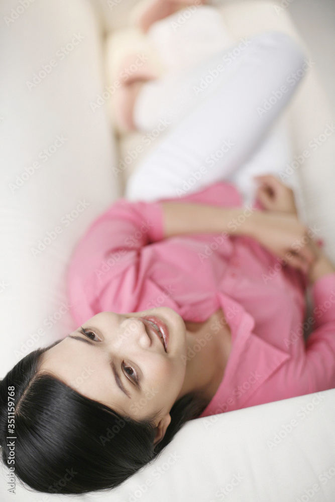 Businesswoman relaxing on the couch Businesswoman relaxing on the couch