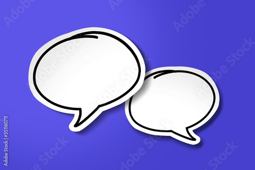 White paper cut speech bubble on blue background.