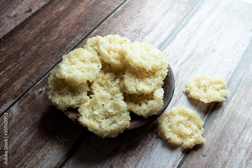 Raw Ranggining. A unique kind of Rengginang, made from variety of traditional tapioca and rice crackers sticked together and shaped into a disc. photo