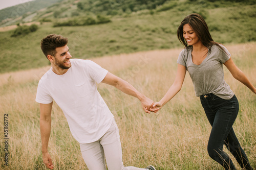 Young couple in love walkin...