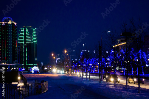 Russia Chechen Republic. Terrible. Snow-covered alley with lanterns in the city center. © Irida