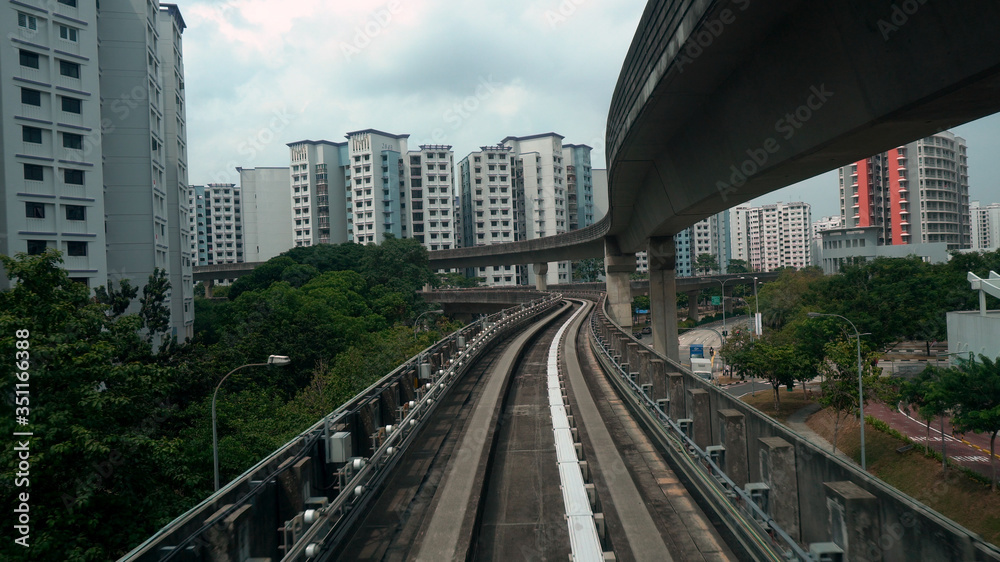 Driverless LRT Train on Elevated Tracks in City of Singapore