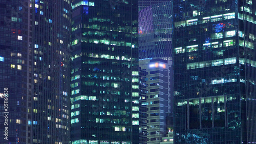 Exterior Establishing Of Modern Office Skyscraper Buildings At Night
