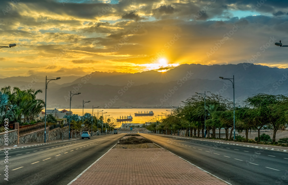 Sunrise on the road in Eilat - perfect vacation spot suitable for the blend of fun, sunburn, diving, partying and relaxing by swimming in clear water of the Red Sea