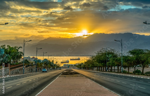 Sunrise on the road in Eilat - perfect vacation spot suitable for the blend of fun  sunburn  diving  partying and relaxing by swimming in clear water of the Red Sea