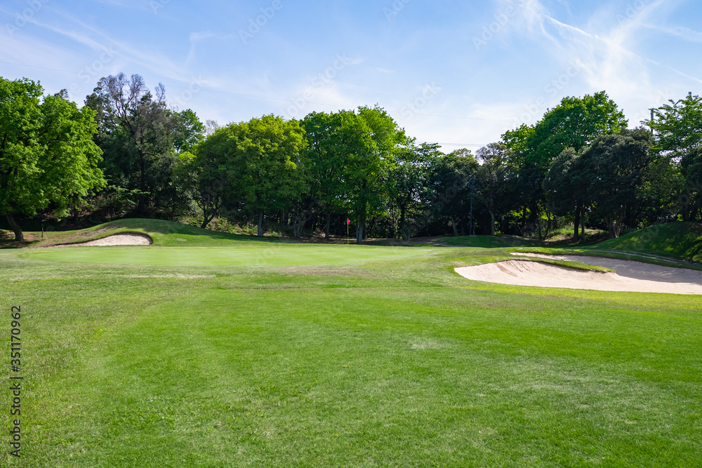 View of Golf Course with beautiful putting green. Golf course with a rich green turf beautiful scenery.