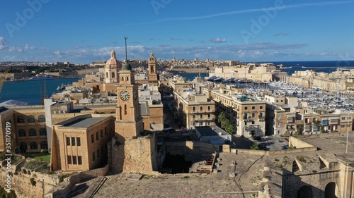 Aerial view of Senglea, Bormla, Valletta old architecture, ancient churches, fortress, cathedrals, bell towers, harbour with sailing boats. Malta. Travel destination. Summer sunny day.
 photo