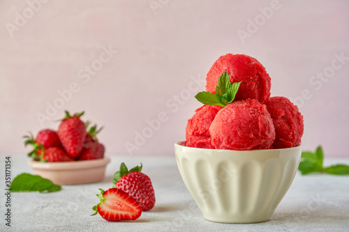 Fotografie Homemade strawberry, red berry ice cream , sorbet with mint leaves  and fresh st