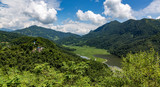 Panoramic view of a valley with a river surrounded by mountains in Nepal