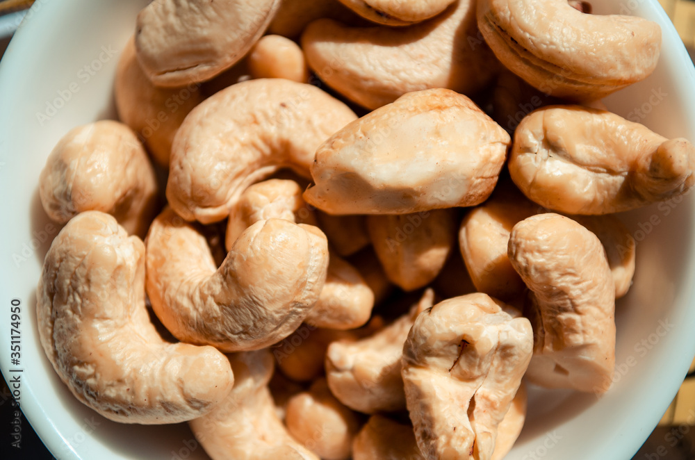 Tasty cashew nuts as background, top view Tasty cashew nuts as background, top view