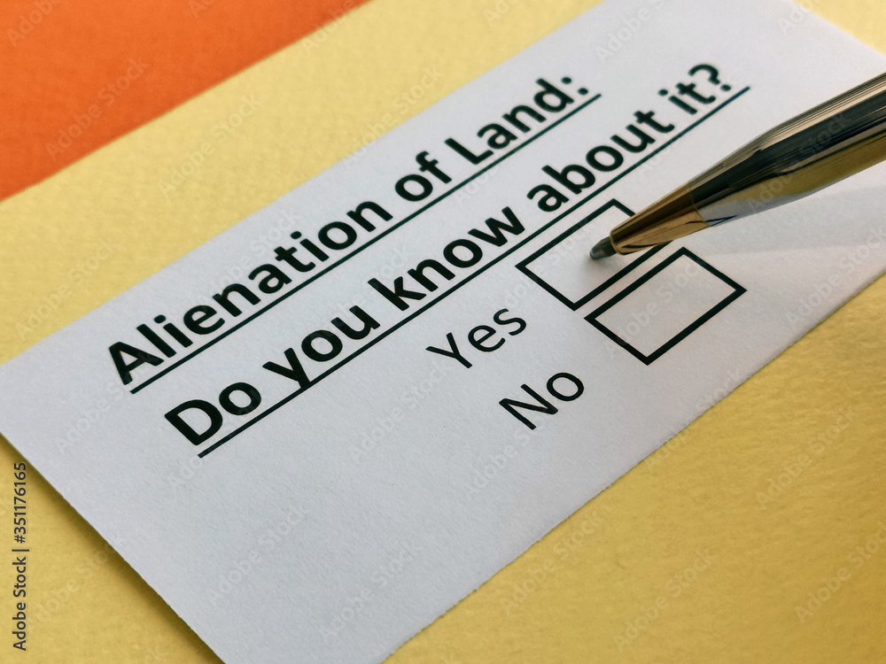 One person is answering question about alienation of land. One person is answering question about alienation of land.