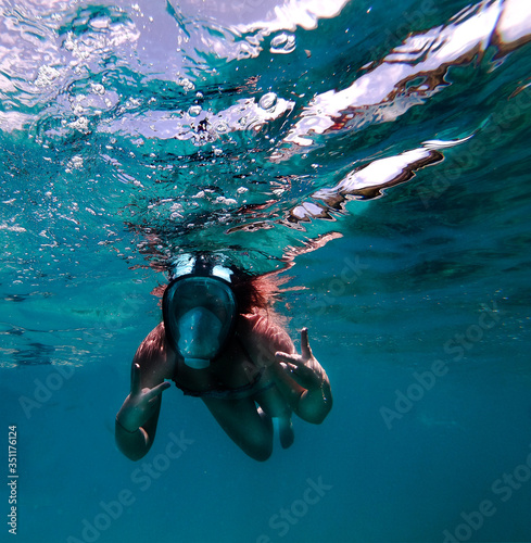 Portrait of a young woman underwater