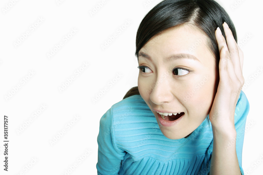 Woman covering her ear. Woman covering her ear.