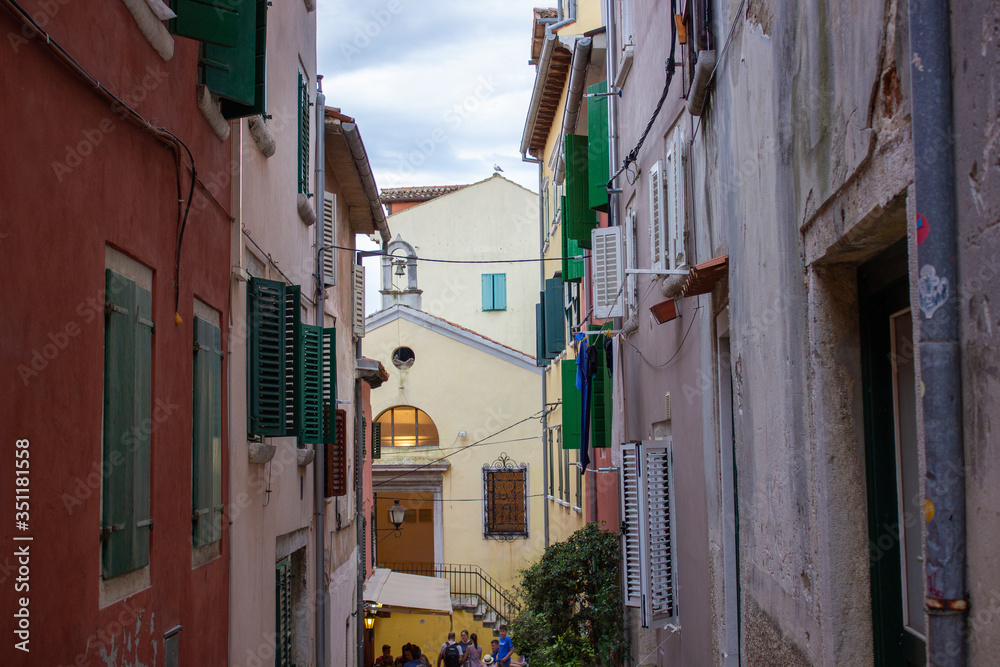 Typical narrow alley with croatian houses in the picturesque old town of Rovinj, Croatia