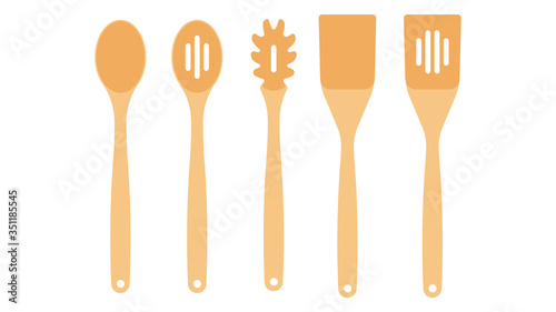 Wooden tools for the kitchen: spoons paddles for cooking. Row of assorted wooden kitchen utensils. 