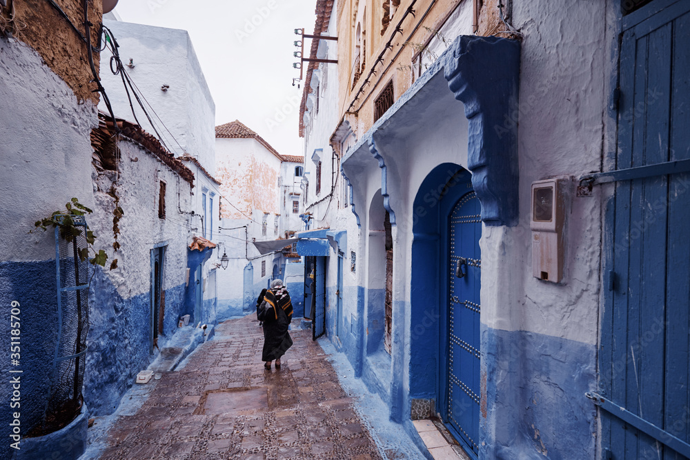 Street in medina of blue town Chefchaouen, Morocco.