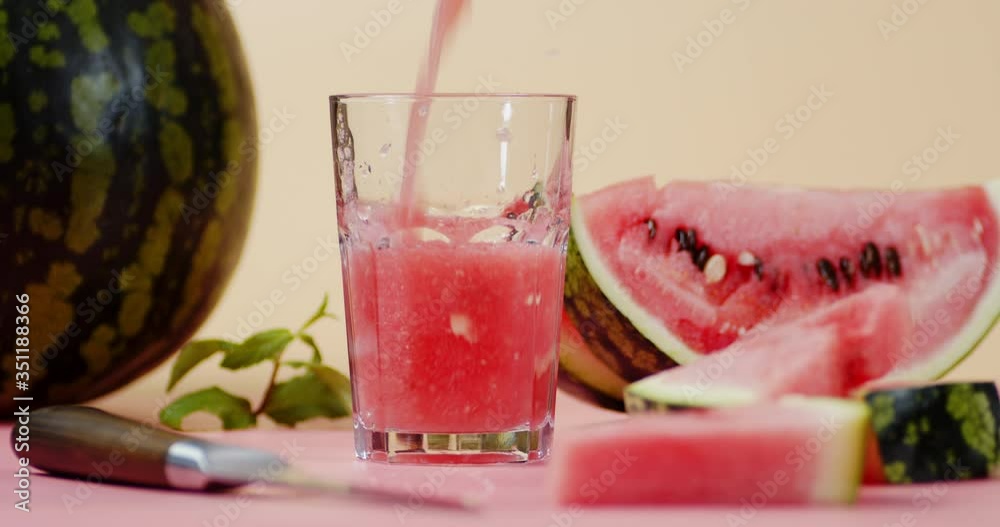Smoothies juicy watermelon is poured into a glass. Smoothies juicy watermelon is poured into a glass.
