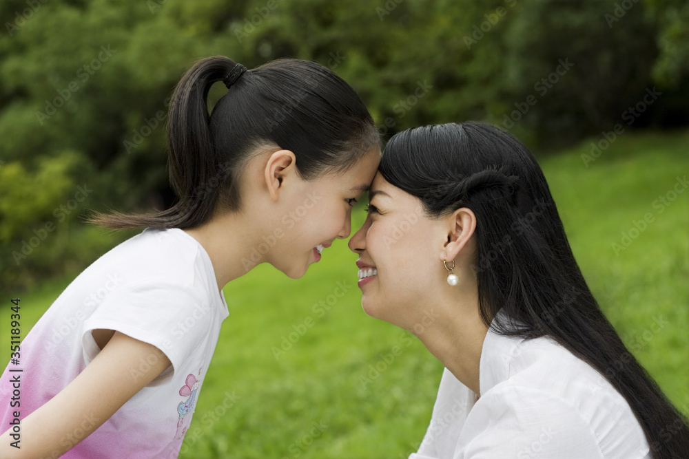 Mother and daughter looking at each other Mother and daughter looking at each other