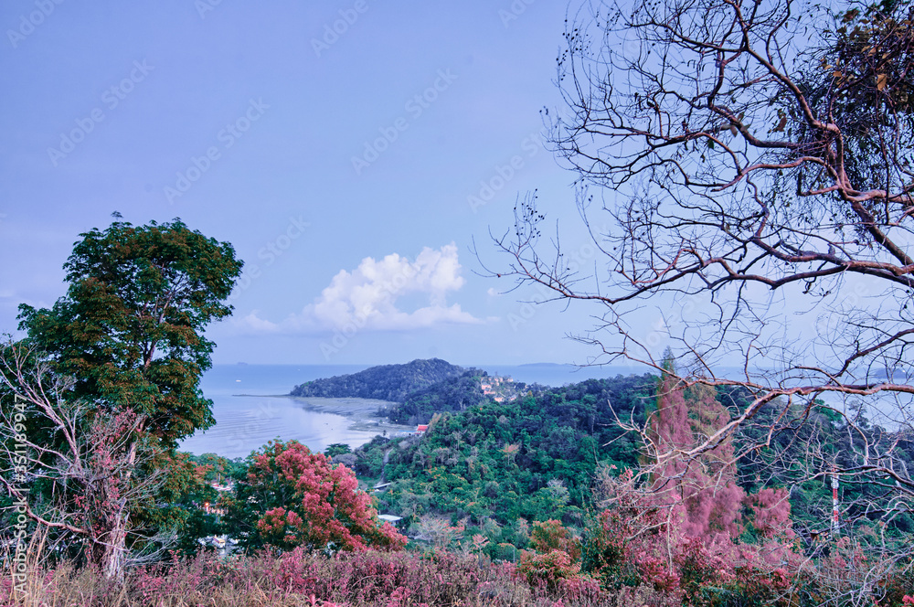 Magnificent view on Phuket mountains covered with exotic plantlife surrounded by ocean. Phuket, Thailand. Magnificent view on Phuket mountains covered with exotic plantlife surrounded by ocean. Phuket, Thailand.
