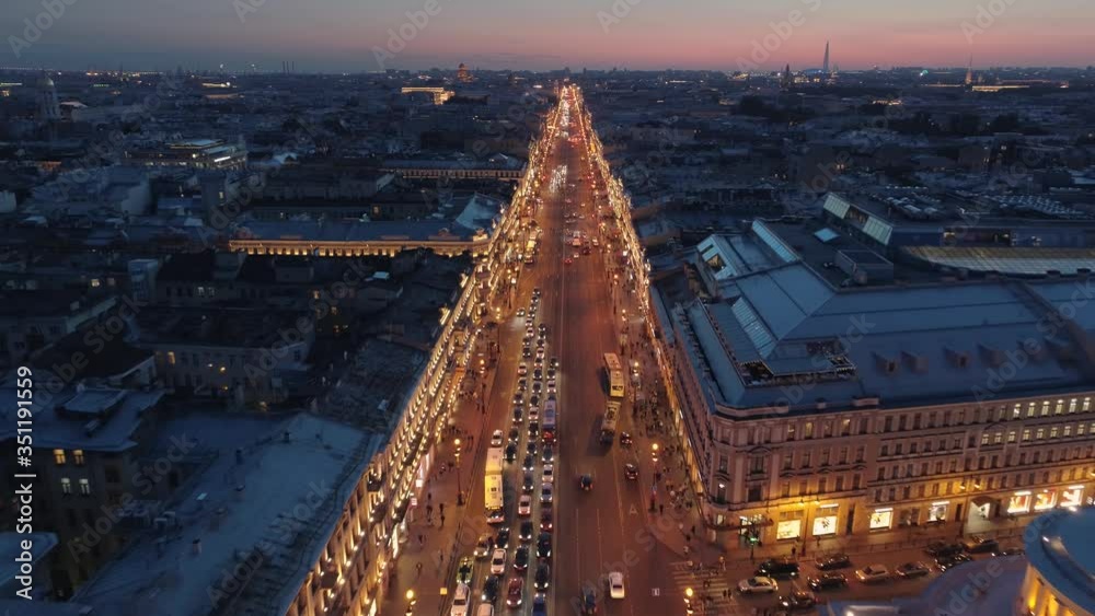 Flight backwards sunset St. Petersburg Nevsky avenue square Road active traffic. Best downtown landmark. Soviet obelisk stella star. Roundabout junction. Many people walk subway. White night
