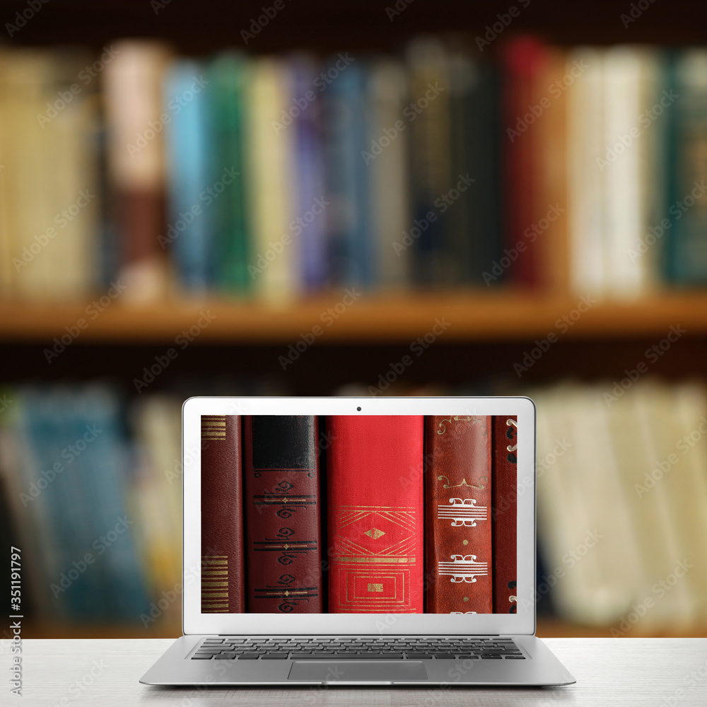 Digital library concept. Modern laptop on table indoors - obrazy, fototapety, plakaty 
