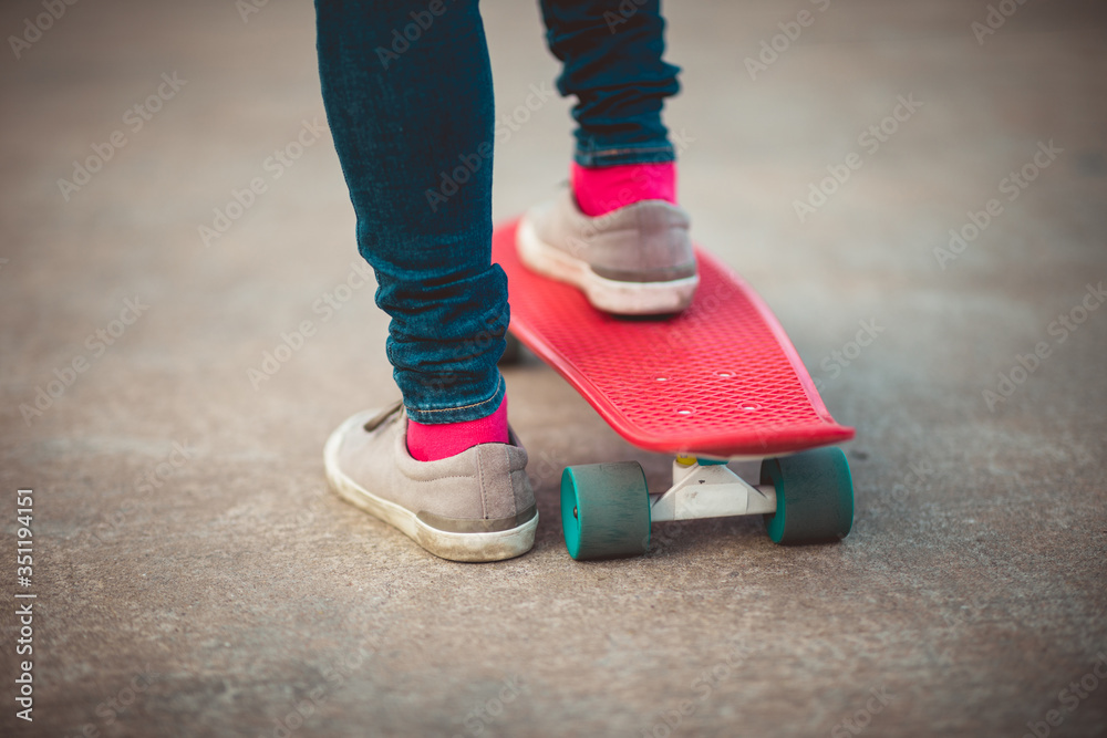 Skateboarder legs skateboarding at outdoors Skateboarder legs skateboarding at outdoors