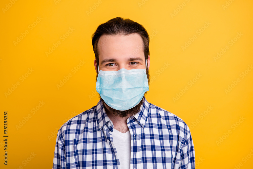 Close-up portrait of his he nice cheerful bearded guy wearing breathing mask checked shirt IT expert stay home quarantine isolated bright vivid shine vibrant yellow color background Close-up portrait of his he nice cheerful bearded guy wearing breathing mask checked shirt IT expert stay home quarantine isolated bright vivid shine vibrant yellow color background