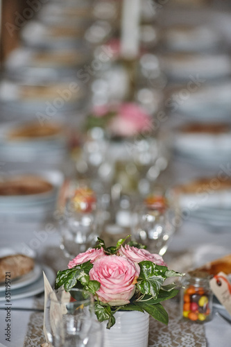 bouquet of pink roses on a wedding table, table decor