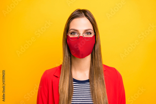 Closeup portrait of attractive lovely winsome brainy genius straight hair lady use protective facial mask at work study responsible citizen isolated vivid yellow background
