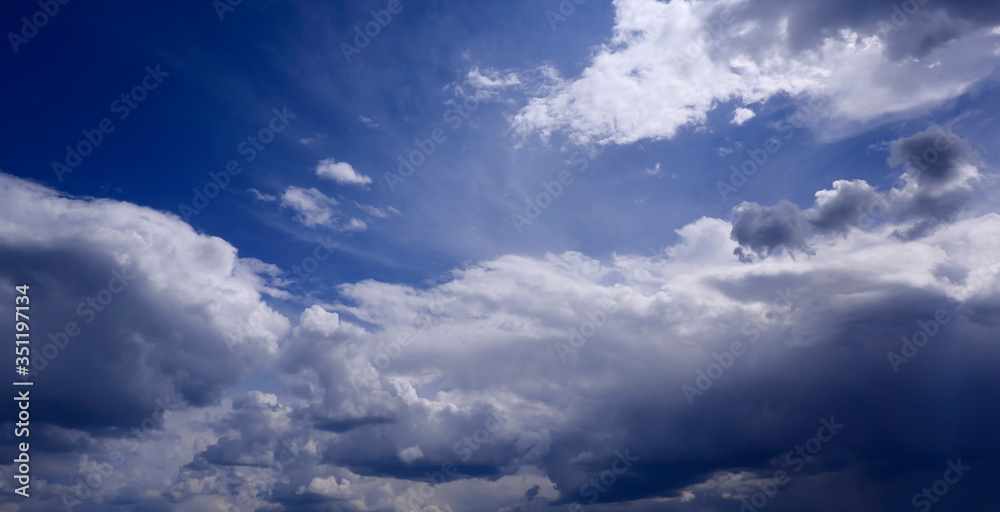 Rich and fascinating clouds on a bright Sunny day in a blue sky Rich and fascinating clouds on a bright Sunny day in a blue sky
