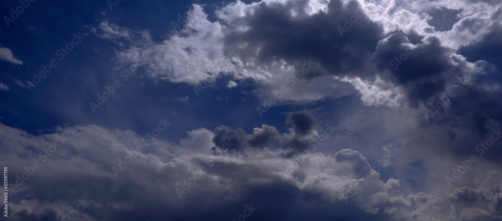 Rich and charming clouds on a bright Sunny day in a blue sky