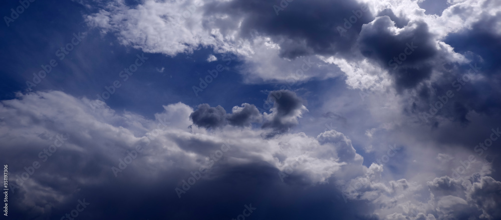 Rich and pretty clouds on a bright Sunny day in a blue sky