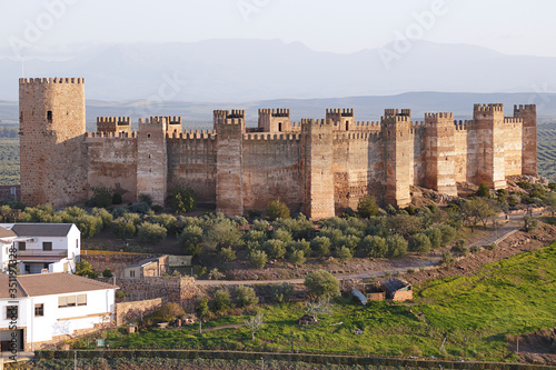 Burgalimar Castle built in the 10th century on a small hill that dominates the town of Banos de la Encina, located in the north of the province of JaÃ©n (Andalusia, Spain) photo