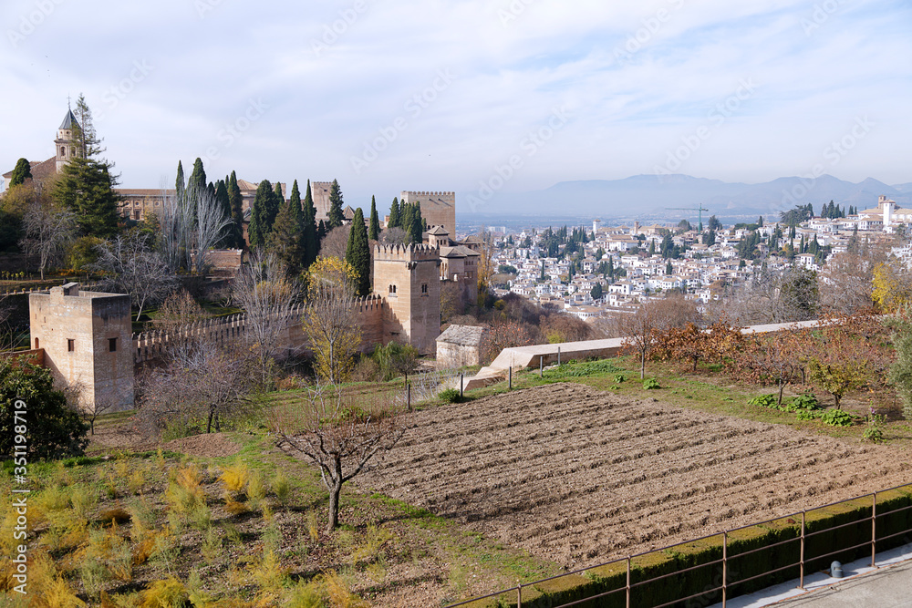 Partial view of the Alhambra, in the background the city of Granada, Spain