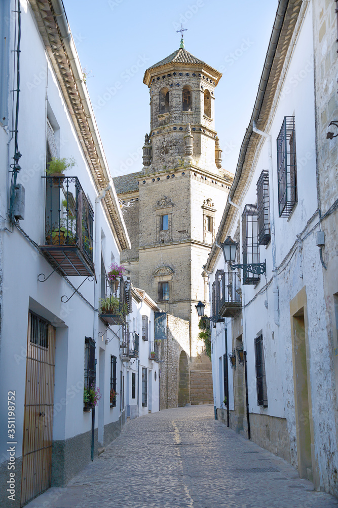 Medieval street of Baeza with old University Tower, Jaen, Spain