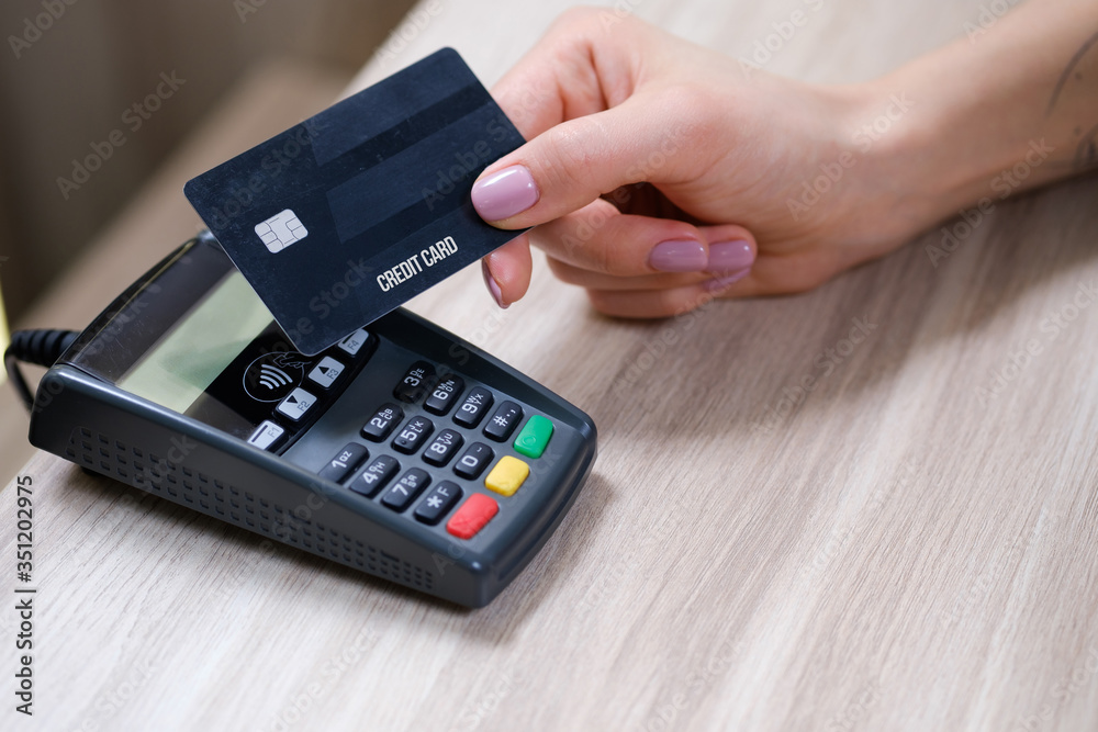 Customer using credit card for payment to owner at cafe restaurant, cashless technology and credit card payment concept Customer using credit card for payment to owner at cafe restaurant, cashless technology and credit card payment concept