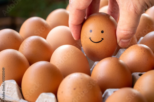Eggs in the hands smile with a good mood, the concept is happy to eat.
