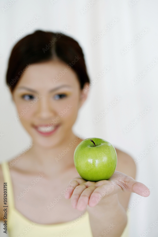 Woman holding green apple Woman holding green apple