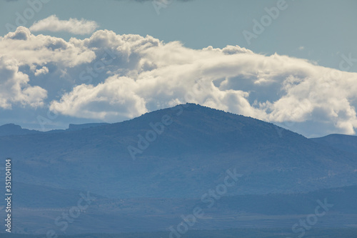 Landscape of mountains with clouds in the Moncayo area and the Iberian mountain system, looking towards Cabezo de Los Frailes in the Tabuenca area, Talamantes, near Borja, Zaragoza province. © Alvaro