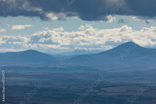 Landscape of mountains with clouds in the Moncayo area and the Iberian mountain system, looking towards Cabezo de Los Frailes in the Tabuenca area, Talamantes, near Borja, Zaragoza province.