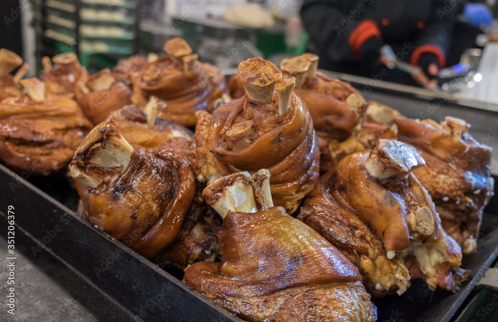 Roasted Pork Knuckle with Crispy Skin  for sale at christmas tradition market. Budapest. Hungary