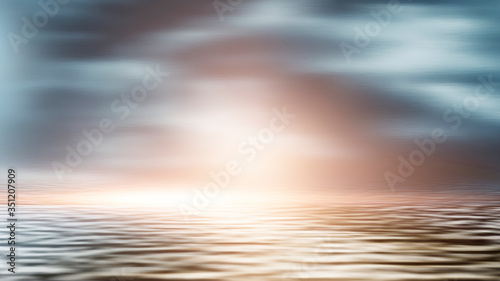 Fototapeta Naklejka Na Ścianę i Meble -  Sea landscape, sea surface. Blue sky, clouds, sunlight, rays. Empty natural scene in the open air. Blurred abstract background. Background of a sea landscape. Blue sky with clouds over the sea. 