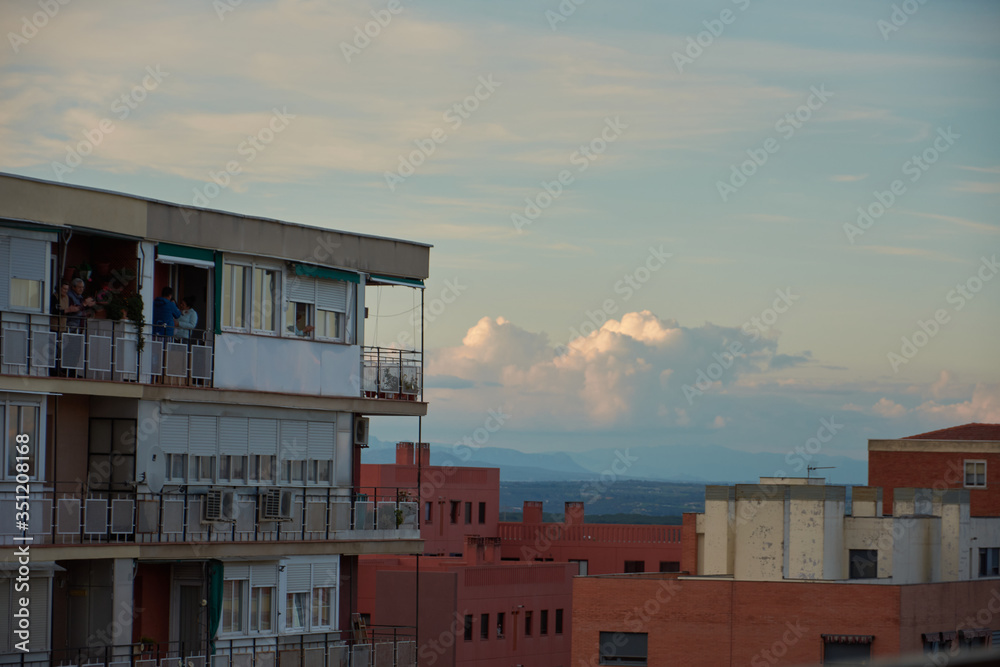 Neighbors come out to applaud the balconies during the quarantine decreed by the state of alarm in Madrid. Spain Neighbors come out to applaud the balconies during the quarantine decreed by the state of alarm in Madrid. Spain