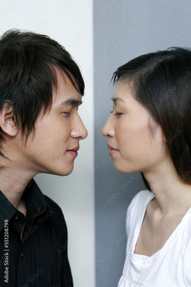 Man and woman closing eyes, about to kiss Man and woman closing eyes, about to kiss