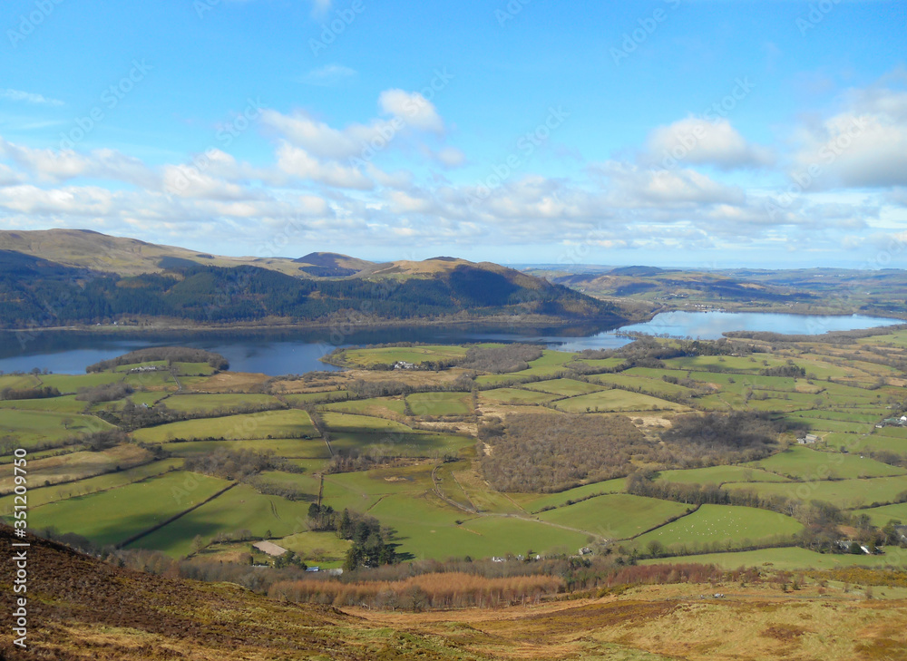 Naklejka premium Lake District fields with lake and clouds