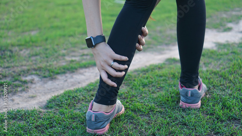 Calf leg injury accident in sport exercise running jogging.sprain or cramp Overtrained injured person when training exercising or running outdoors.