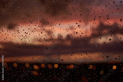 Water drops on a window, after a storm, during a sunset. Madrid. Spain