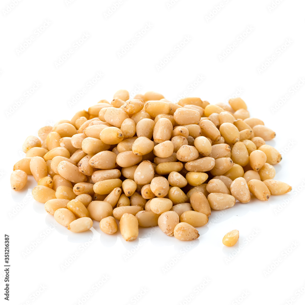 Delicious pine nuts isolated on white Delicious pine nuts isolated on white
