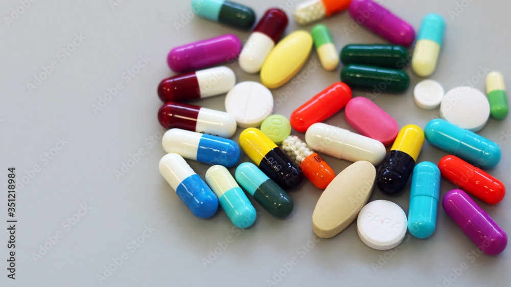 Colorful tablets, pills and capsules medicine using for treatment and cure the disease or sickness. Drug prescription using for medication in medical clinic, pharmacy Pharmaceutical service concept.